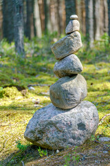 Pyramid of stones. Unstable balance of stone objects. Idyllic state of nature.