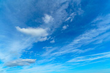 Naklejka na ściany i meble White clouds in the blue sky. Beautiful natural background.