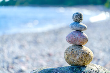 Pyramid of stones. Unstable balance of stone objects. Idyllic state of nature.