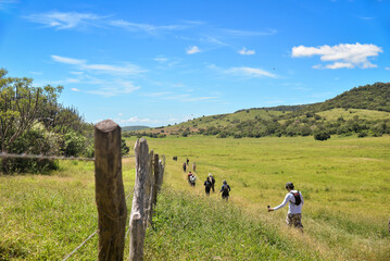 group walking on a trail towards the mountain, Araruna, Pb, Paraíba, Brazil, brazilian trails,...
