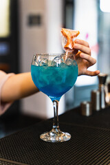blue cocktail in bar