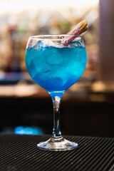 blue cocktail in bar