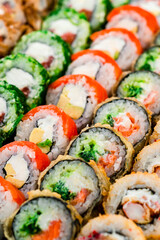 set of different colorful maki sushi rolls sushi texture background © smspsy