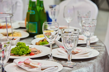 Crystal glasses for newlyweds wedding, decorated for the holiday.