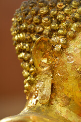 Close-up of the golden Buddha's ear