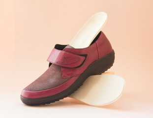 Orthopedic insoles with orthopedic shoes. Accessories for the prevention of foot problems.