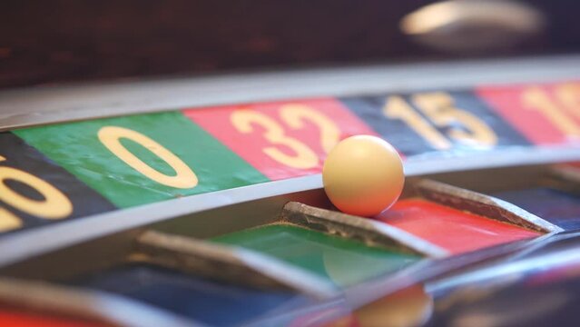 Ball on french roulette table in casino. Wheel spinning, turning or rotating. Odd and even numbers, black, red and zero sectors. Game of chance, money playing, gambling. Seamless looped cinemagraph.