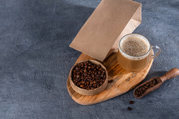 Coffee identity branding mockup. Blank brown craft bag with coffee beans and cup of coffee. Package...