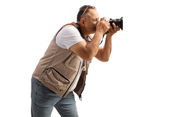 Fototapeta premium Profile shot of a photo reporter recording with camera