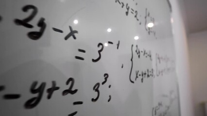 Solved mathematics equation on whiteboard.Education concept. - Powered by Adobe