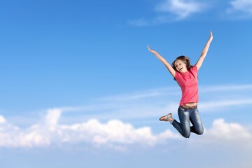 Fototapeta na wymiar Young smiling happy woman jump high. People lifestyle concept