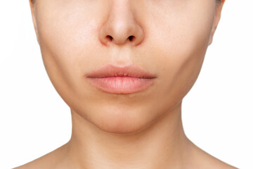 Cropped shot of a young caucasian woman's lower part of the face with clear highlighted cheekbones isolated on white background. Plastic surgery buccal fat removal. Result of cosmetic surgery