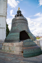 Tsar bell on a granite pedestal with a beautiful pattern against the blue sky in the Kremlin, Moscow. Sights of Russia. Architecture of World Tourism.