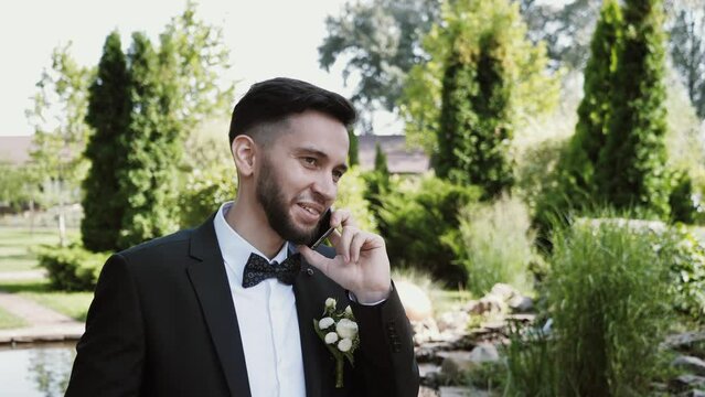 Portrait of a handsome young man talking on the phone