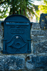 post box, embedded in a stone wall