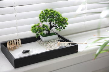 Beautiful miniature zen garden on window sill