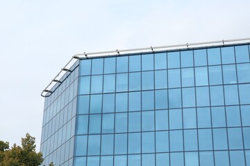 Fototapeta na wymiar Modern building against blue sky. Urban architecture