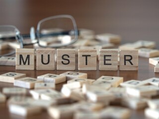 muster word or concept represented by wooden letter tiles on a wooden table with glasses and a book