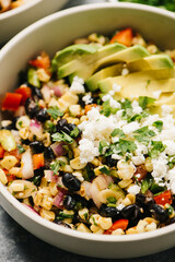 Mexican Street Corn Salad Closeup with Cojita cheese and Avocado