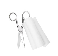 Medical bandage rolls and scissors on white background, top view