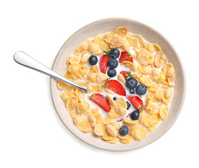 Bowl of tasty crispy corn flakes with milk and berries isolated on white, top view