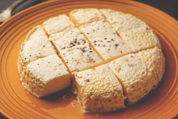 Kharvas or Cheek, Chik, Bari, Pis or Junnu is a sweet dairy product made from bovine colostrum