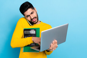 Photo of handsome busy guy dressed yellow pullover working modern gadgets prepare signing contract isolated blue color background