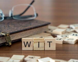 wit word or concept represented by wooden letter tiles on a wooden table with glasses and a book - obrazy, fototapety, plakaty