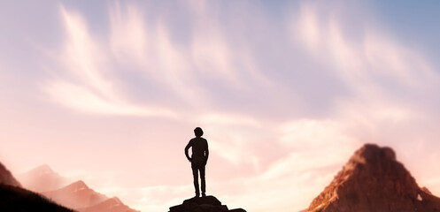 Men standing on a rugged mountain see the breathtaking sunset scenery. Travel adventure and victory concept.