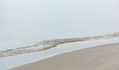 Background with Calm Ocean Waters Along Shoreline at the Beach