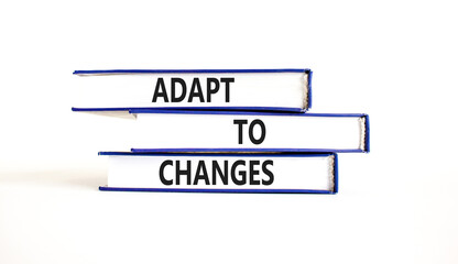 Adapt to changes and support symbol. Concept words Adapt to changes on books. Beautiful white table...