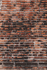 Red brick wall texture. Abstract brick wall background, wall of old, cracked bricks, with a weathered and faded surface. vertical.                          