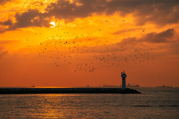 Amazing Sunset and Kadikoy Lighthouse. View from a cloudy day in Istanbul.