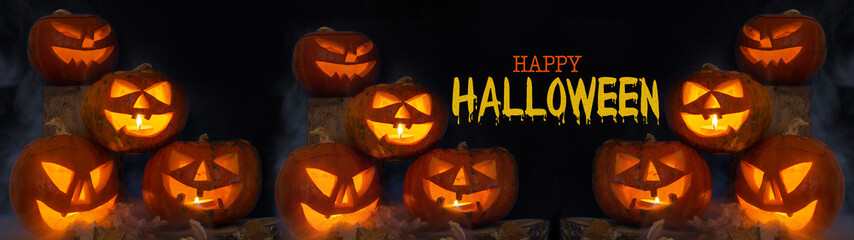 Scary Halloween celebration holiday background banner panorama - Spooky carved pumpkins and dust in...