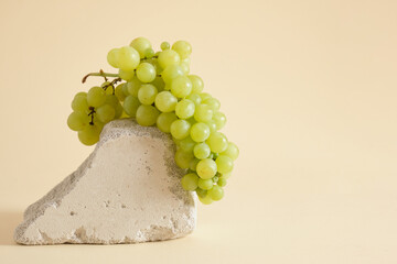 showcase for your product with grapes beige background