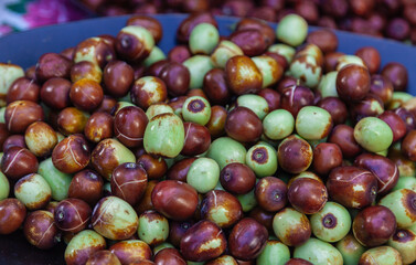 Selective focus on fresh jujube fruits.