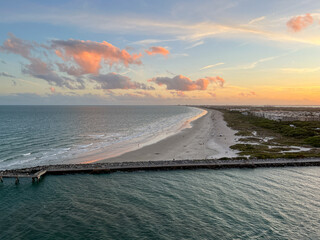An aerial view of  Port Canaveral at sunset during a cruise ship sail away in Orlando, Florida.