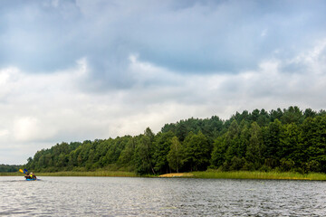 a blue kayak on the Ostriv'yanske lake, Shatsk National Natural Park, Ukraine