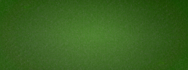 Fototapeta premium The texture of the dark green. The background of dark olive cloth. Luxury background of dark olive velvet