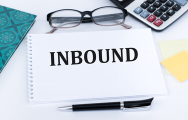 INBOUND text on a notepad on an office desk. Business concept