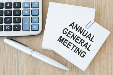 A card with the text AGM Annual General Meeting. Business concept.