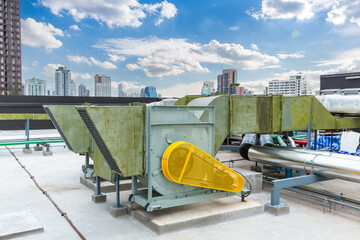 Air conditioner compressor installed on roof building.  Industrial air conditioning units. Industrial air conditioning and ventilation systems on roof. Cooling towers in data center building. 