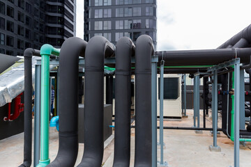 Pipe of air conditioner system on roof. a lot of pipe for air conditioner system. Industrial air conditioning tubes. Ventilation system and pipe systems installed on industrial building.