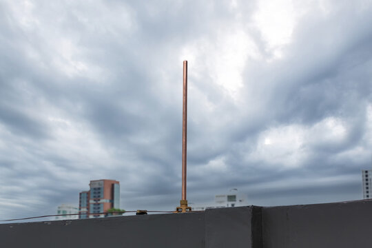 Lightning rod for Lightning protection and protect electrical equipment damage when lightning strike. Air terminal rod and bare copper cable install on rooftop building