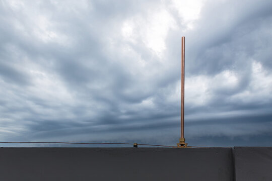 Lightning rod for Lightning protection and protect electrical equipment damage when lightning strike. Air terminal rod and bare copper cable install on rooftop building