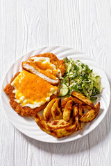 chicken parmo with coleslaw and roast potatoes
