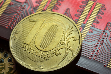 Russian coin with a face value of 10 rubles. lies among the microcircuits. (the concept of the digital economy of Russia)