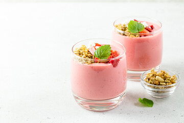 Berry oatmeal yogurt parfait  in glasses. Copy space, flat lay.