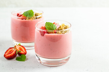 Srawberry yogurt parfait in glasses. Copy space, flat lay.