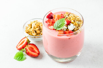 Healthy strawberry oatmeal granola yogurt dessert in glasses. Copy space, flat lay.